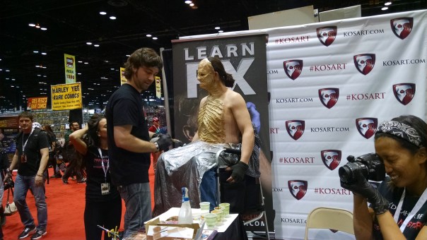 The KOSART booth with Anthony from Face/Off doing a live make up.